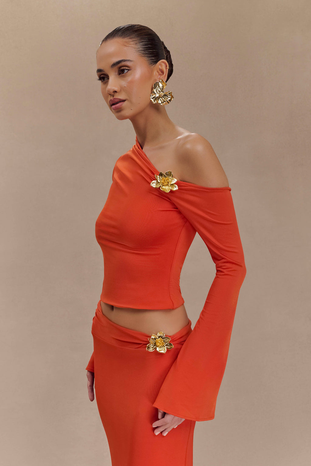 Ainsley Asymmetrical Long Sleeve Top With Floral Hardware in Burnt Orange – Chic&Drifts