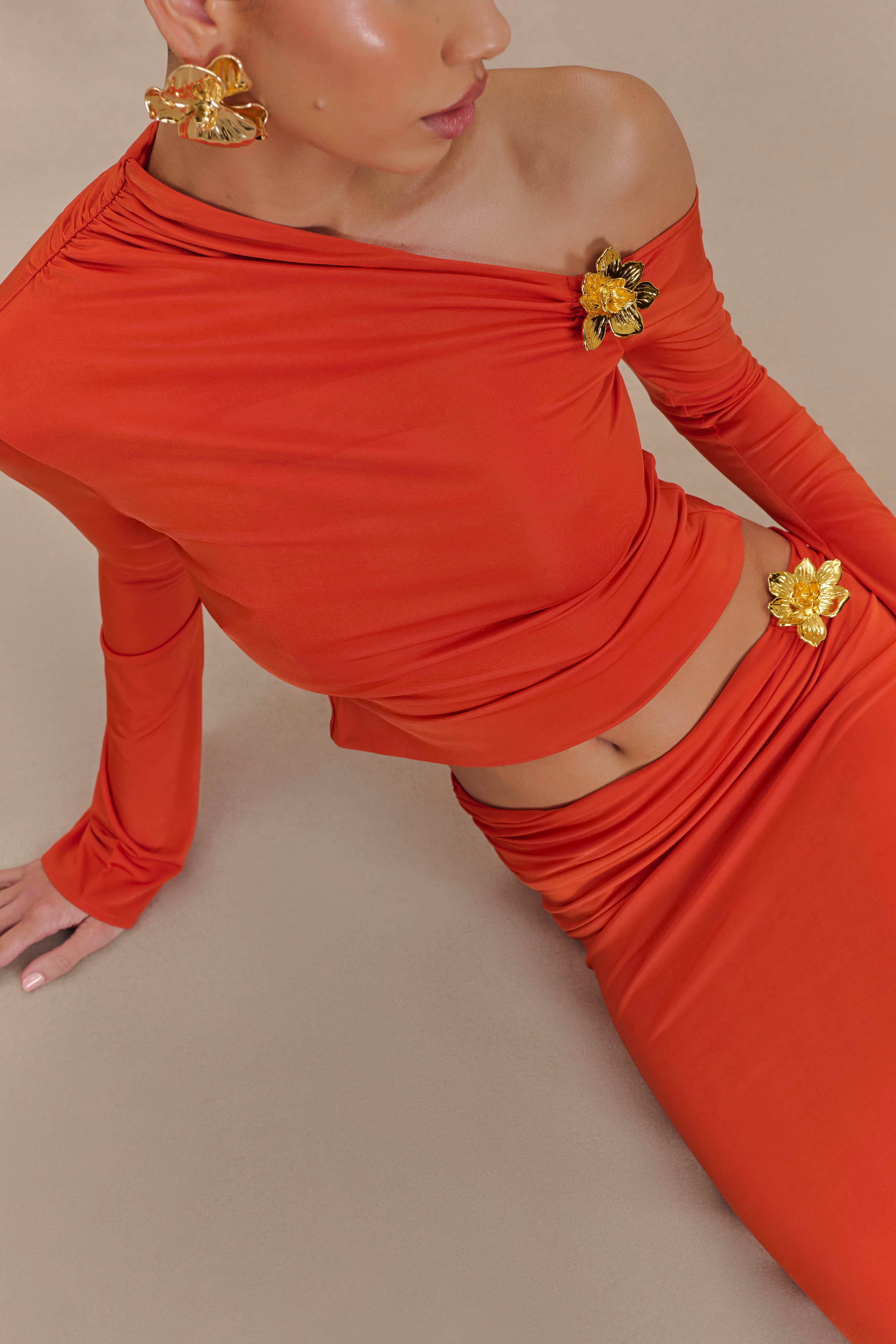 Ainsley Asymmetrical Long Sleeve Top With Floral Hardware in Burnt Orange – Chic&Drifts
